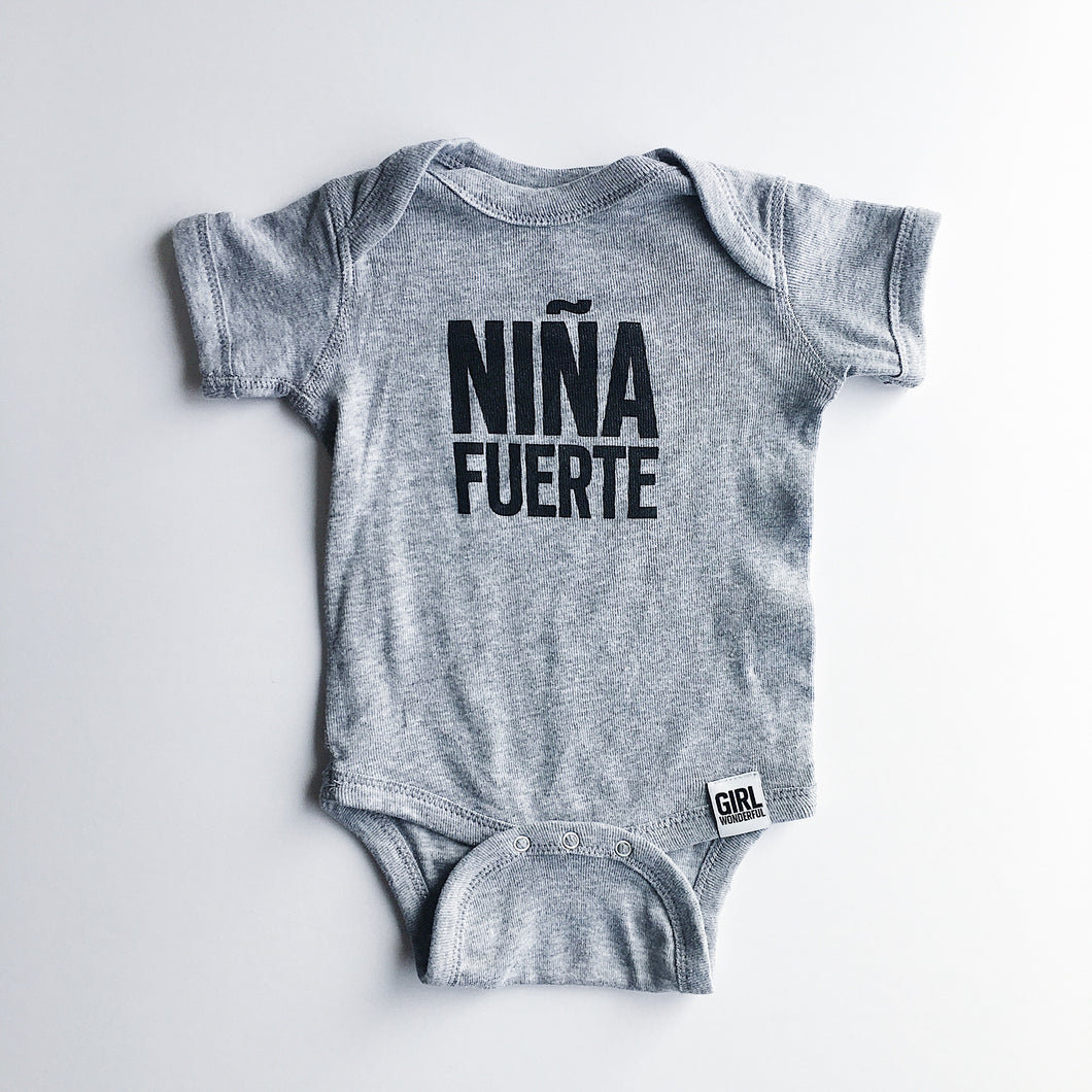 NIÑA FUERTE ONESIE, this super soft is perfect for a baby girl, and will pair well with anything, like the Modern Burlap Lightning Bolt Swaddle!